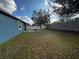 Grass backyard with fire pit and privacy fence at 1570 Fox Grape Loop, Lutz, FL 33558