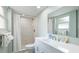 Updated bathroom with a walk-in shower and white vanity at 524 Beach Rd # A, Sarasota, FL 34242
