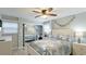 Bedroom with a queen bed, mirrored closet, and coastal decor at 524 Beach Rd # A, Sarasota, FL 34242