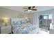 Main bedroom with king-size bed, private access to patio, and ocean views at 524 Beach Rd # A, Sarasota, FL 34242