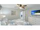 Bright bedroom with a queen bed, dresser, and TV at 524 Beach Rd # A, Sarasota, FL 34242