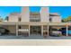 Condo building exterior showcasing covered parking and beach access at 524 Beach Rd # A, Sarasota, FL 34242