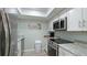 Modern kitchen with stainless steel appliances and light cabinets at 524 Beach Rd # A, Sarasota, FL 34242