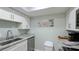 Modern kitchen with stainless steel appliances and light cabinets at 524 Beach Rd # A, Sarasota, FL 34242