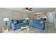 Living room with comfortable seating, access to patio, and ocean views at 524 Beach Rd # A, Sarasota, FL 34242