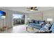 Living room with comfortable seating, access to patio, and ocean views at 524 Beach Rd # A, Sarasota, FL 34242