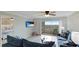 Living room with comfortable seating, access to patio, and ocean views at 524 Beach Rd # A, Sarasota, FL 34242