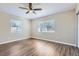 Bright bedroom with wood-look flooring and window blinds at 6256 Kimball Ct, Spring Hill, FL 34606