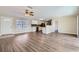 Open living room and kitchen with wood-look flooring at 6256 Kimball Ct, Spring Hill, FL 34606
