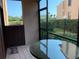 Screened patio with glass-top table and chairs at 1322 Pelican Creek Xing # B, St Petersburg, FL 33707