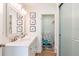 Modern bathroom with double vanity, white cabinets, and a walk-in shower at 1344 Springdale St, Clearwater, FL 33755