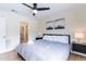 Spacious bedroom with king-size bed, ceiling fan, and an ensuite bathroom at 1344 Springdale St, Clearwater, FL 33755