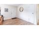 Bright and airy entryway with light wood floors and modern decor at 1344 Springdale St, Clearwater, FL 33755