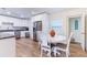 Bright kitchen with white cabinets, granite counters, and stainless steel appliances at 1344 Springdale St, Clearwater, FL 33755