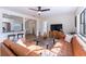 Living area with an open floor plan, featuring a sectional sofa and kitchen view at 1344 Springdale St, Clearwater, FL 33755
