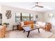 Bright and airy living room with a sectional sofa and large window at 1344 Springdale St, Clearwater, FL 33755
