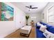 Cozy living room featuring a comfortable blue sofa and coastal-inspired decor at 1344 Springdale St, Clearwater, FL 33755