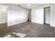 Well-lit bedroom with carpeted floors and ample closet space at 4642 Spahn St, Sarasota, FL 34232