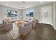 Bright living room with ample seating and hardwood floors at 4642 Spahn St, Sarasota, FL 34232