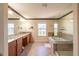 Elegant bathroom boasts a soaking tub, double vanity, and walk-in shower at 20102 Blue Daze Ave, Tampa, FL 33647