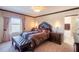 Spacious bedroom with a king-size bed and en-suite bathroom at 20102 Blue Daze Ave, Tampa, FL 33647