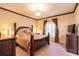 Spacious bedroom with a large bed, dresser, and window at 20102 Blue Daze Ave, Tampa, FL 33647