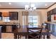 Kitchen dining area with a wooden table, and sliding door leading to backyard at 20102 Blue Daze Ave, Tampa, FL 33647