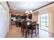 Bright dining area adjacent to kitchen, with sliding glass doors to backyard at 20102 Blue Daze Ave, Tampa, FL 33647