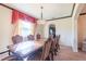 Formal dining room with large table and access to kitchen at 20102 Blue Daze Ave, Tampa, FL 33647