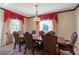 Formal dining room with a large table and elegant chandelier at 20102 Blue Daze Ave, Tampa, FL 33647