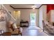 Bright entryway with tiled floors, comfortable seating, and view to backyard at 20102 Blue Daze Ave, Tampa, FL 33647