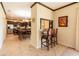 Kitchen breakfast bar with two chairs, offering view into kitchen and living room at 20102 Blue Daze Ave, Tampa, FL 33647
