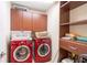 Laundry room with washer, dryer, and storage at 20102 Blue Daze Ave, Tampa, FL 33647