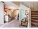 Two-story foyer with a staircase and a glimpse of the living room at 20102 Blue Daze Ave, Tampa, FL 33647
