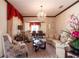 Spacious living room featuring a large sofa and formal dining area at 20102 Blue Daze Ave, Tampa, FL 33647