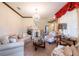 Relaxing living room with ample seating and a view to entryway at 20102 Blue Daze Ave, Tampa, FL 33647