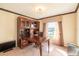 Home office with built-in shelving and large desk at 20102 Blue Daze Ave, Tampa, FL 33647