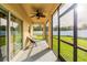 Relaxing screened porch with patio furniture at 20102 Blue Daze Ave, Tampa, FL 33647