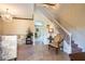 Elegant staircase with white railings and view to living room at 20102 Blue Daze Ave, Tampa, FL 33647