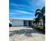 Bright white house exterior with a paved driveway at 9743 36Th N Way # 4, Pinellas Park, FL 33782