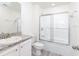 Clean bathroom with tub, shower, and granite vanity at 22162 Seaton Ave, Port Charlotte, FL 33954