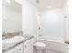 Bright bathroom featuring a tub and shower combination at 22162 Seaton Ave, Port Charlotte, FL 33954