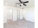 Spacious bedroom with hardwood floors and ceiling fan at 22162 Seaton Ave, Port Charlotte, FL 33954