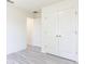 Bedroom with double door closet and hardwood floor at 22162 Seaton Ave, Port Charlotte, FL 33954