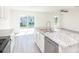 Kitchen island with granite countertops and stainless steel appliances at 22162 Seaton Ave, Port Charlotte, FL 33954
