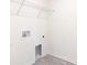 Laundry room with shelving and space for washer and dryer at 22162 Seaton Ave, Port Charlotte, FL 33954