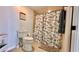 Bathroom with shower/tub combo and beach-themed decor at 420 Gulf Blvd # 101, Indian Rocks Beach, FL 33785