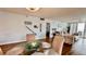 Dining area with glass-top table and view into living room at 420 Gulf Blvd # 101, Indian Rocks Beach, FL 33785