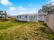 Large backyard with grassy area and detached structure at 11397 86Th Ave, Seminole, FL 33772