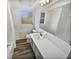 Clean and updated bathroom with a white vanity and tiled floors at 11397 86Th Ave, Seminole, FL 33772